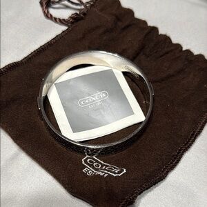 Coach Wide Silver Tone Bangle Bracelet